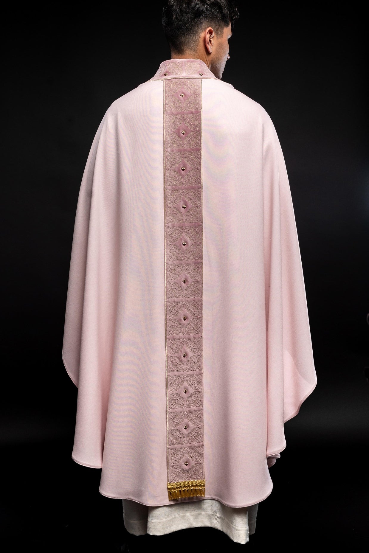 Pink priest robe made of natural touch texture and little decorative metal crosess