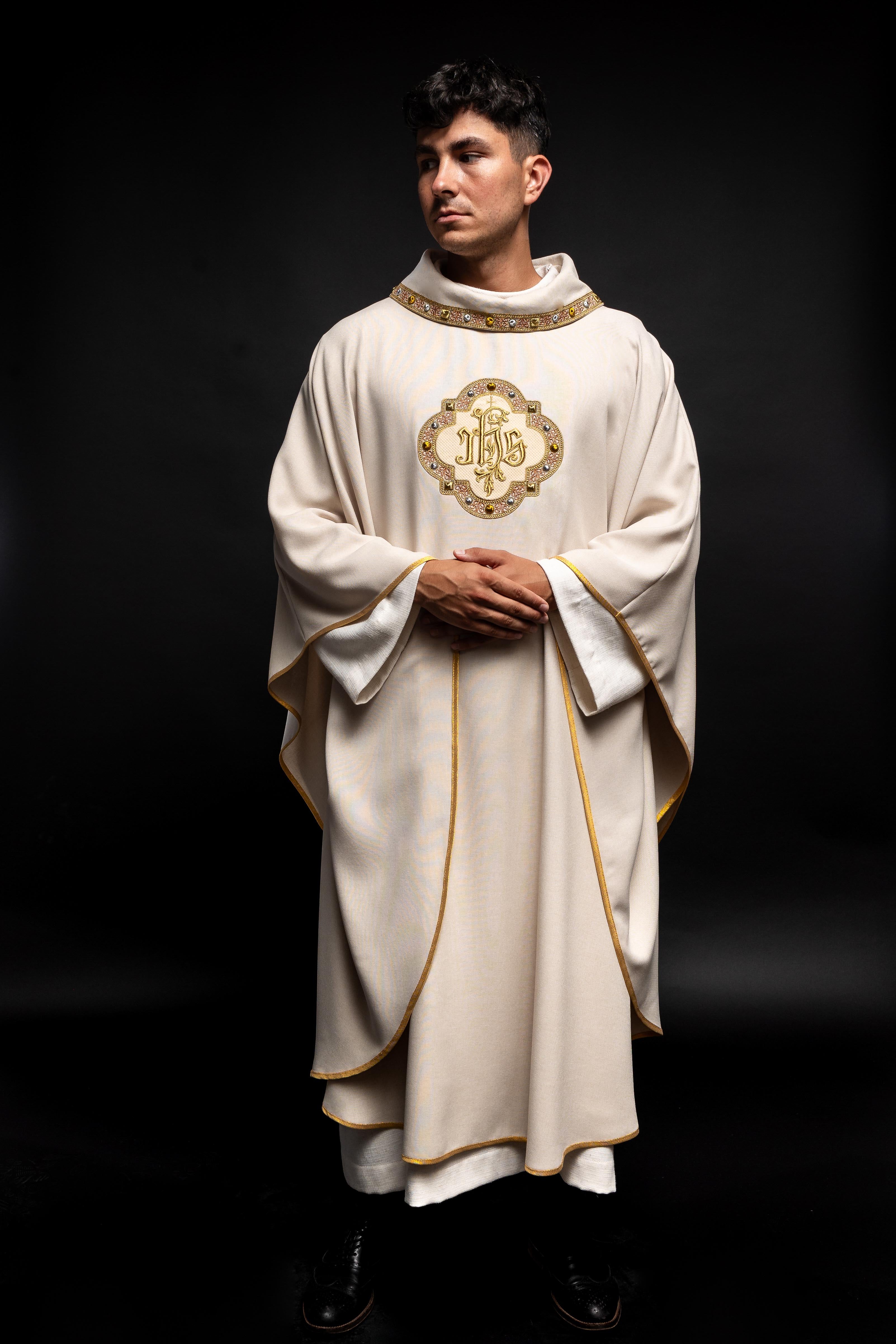 Cream colored chasuble with classic JHS symbol and colorful collar