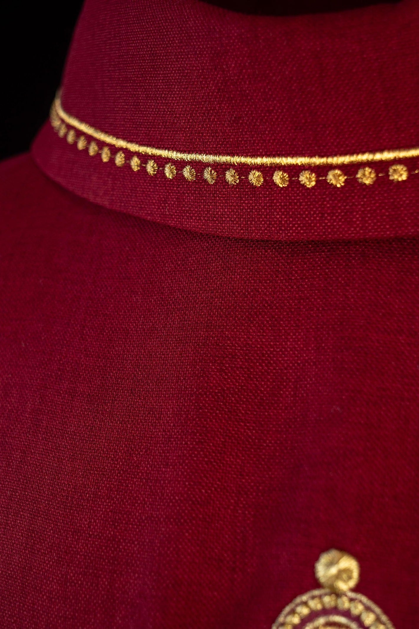 Chasuble with embroidered cross and gold trim on collar in red