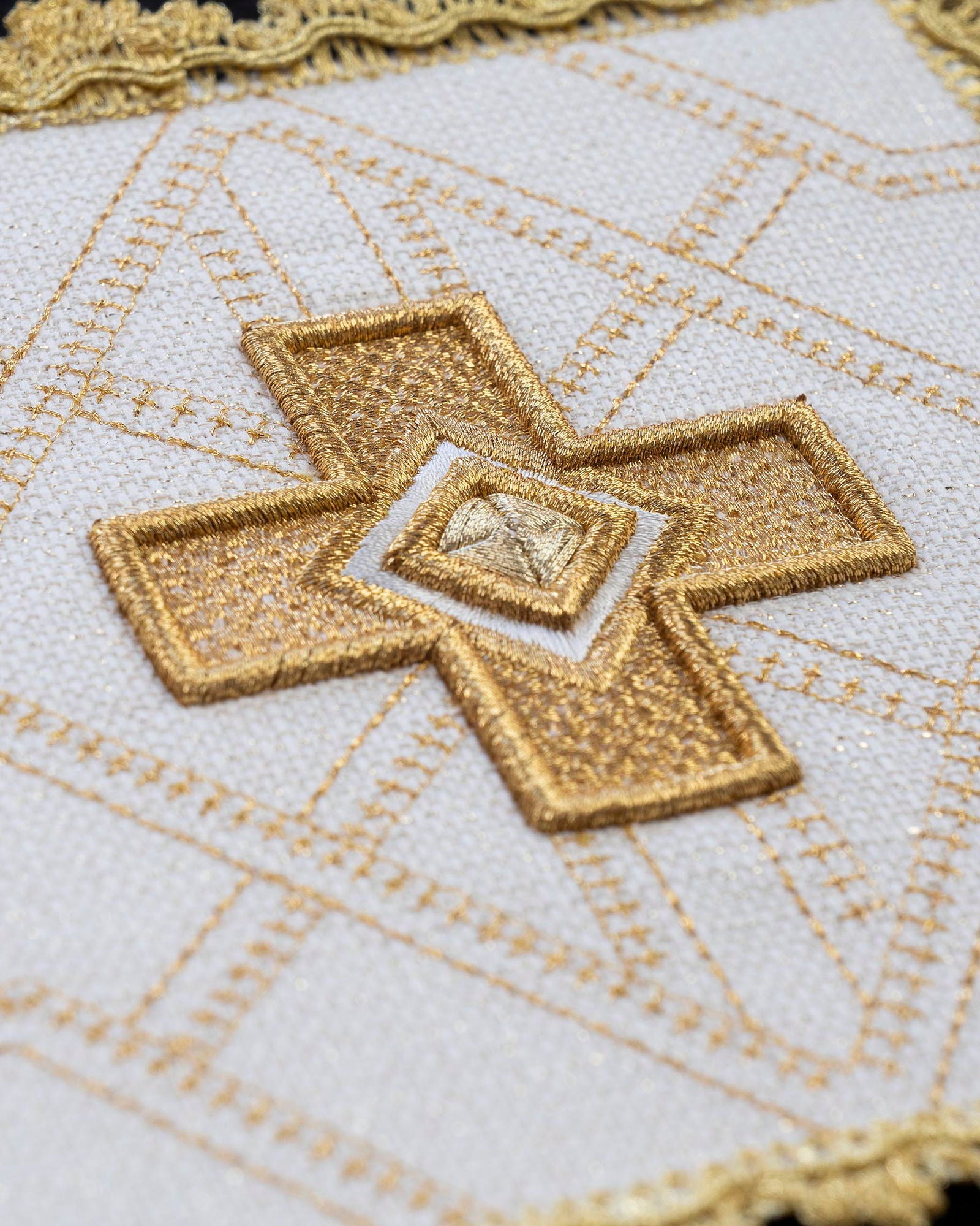 Set of four palls with golden embroidery