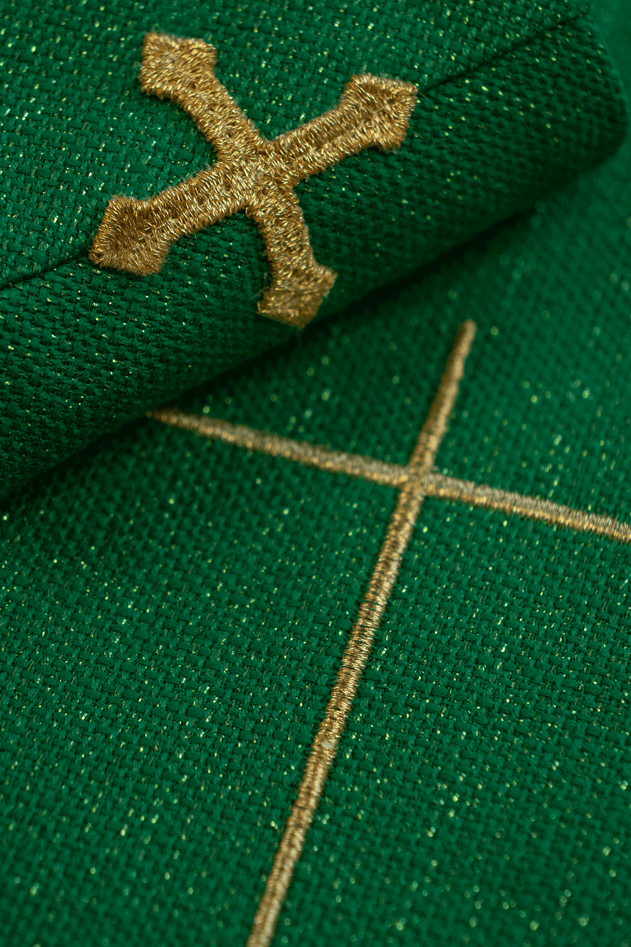 Shiny, richly embroidered green chasuble