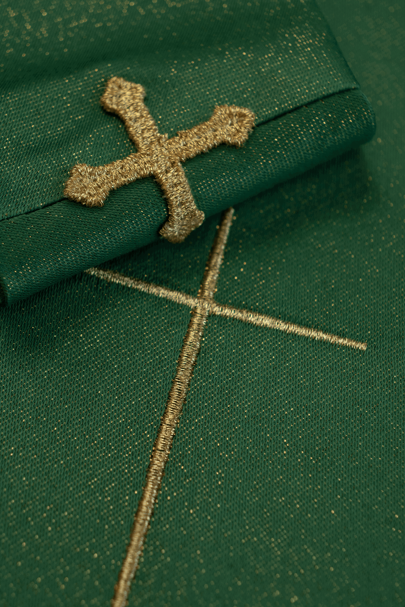 Green chasuble on a glossy fabric