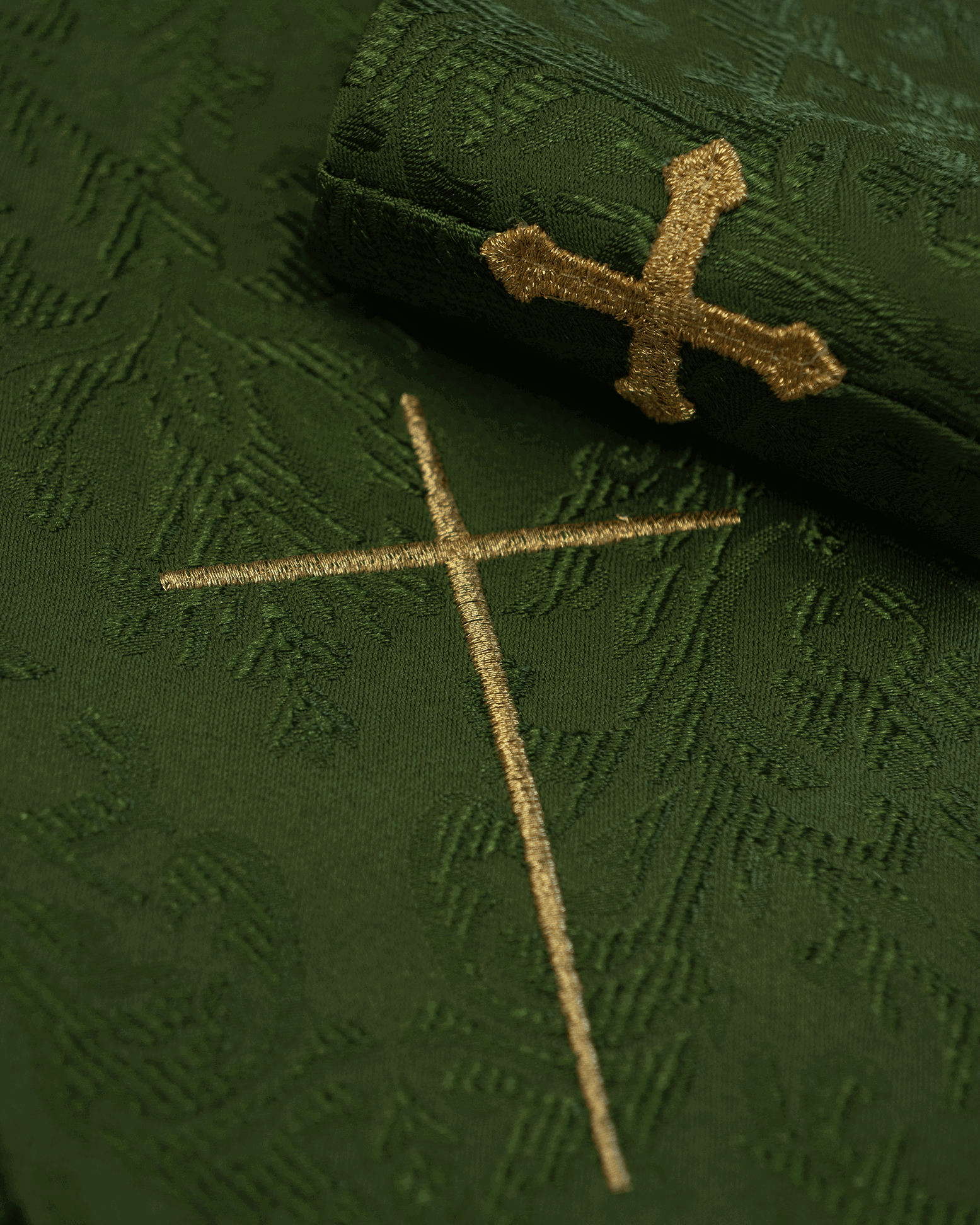 Green liturgical chasuble decorated with an embroidered belt