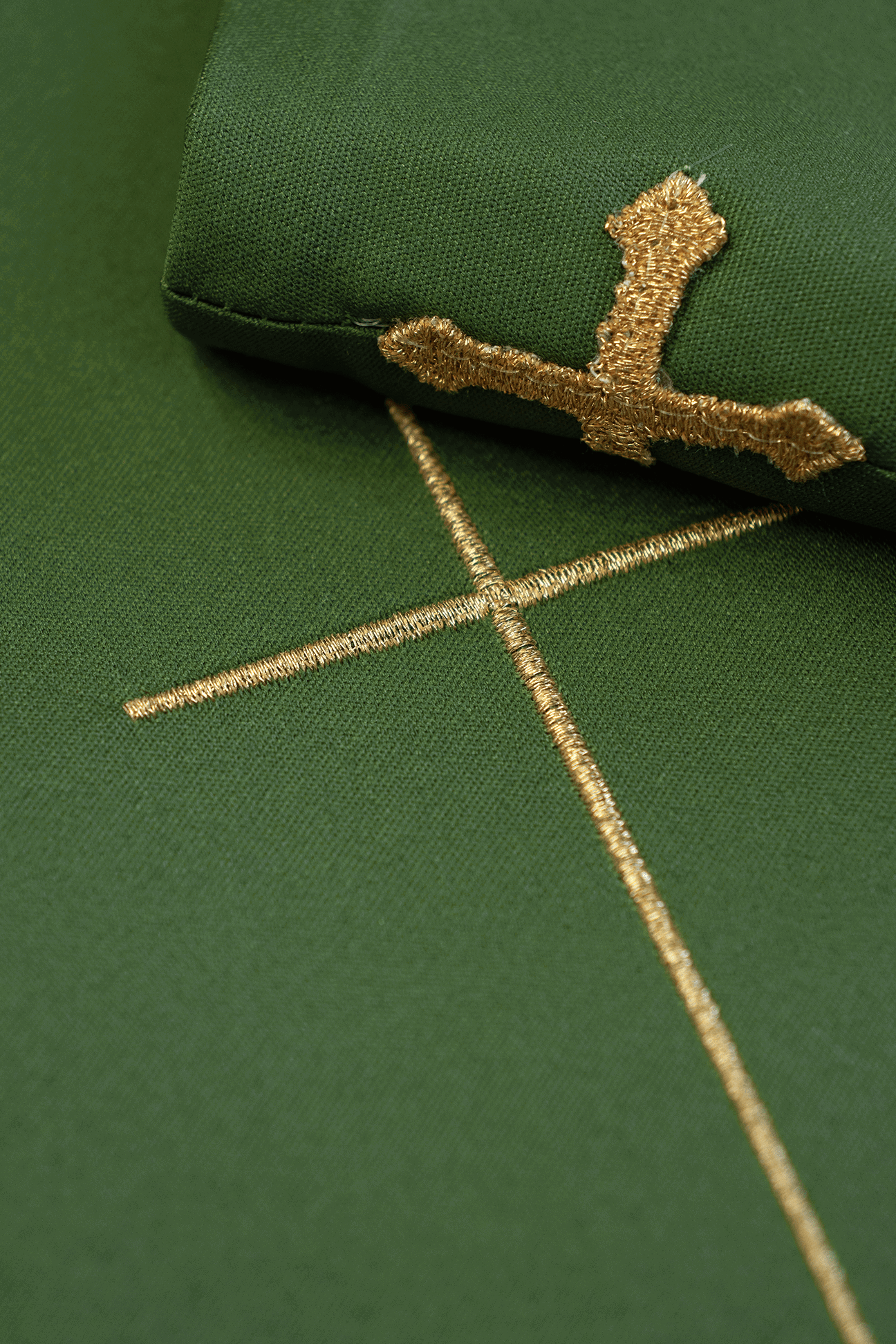 Green chasuble with IHS, ears of wheat, and grapes embroidery on a belt