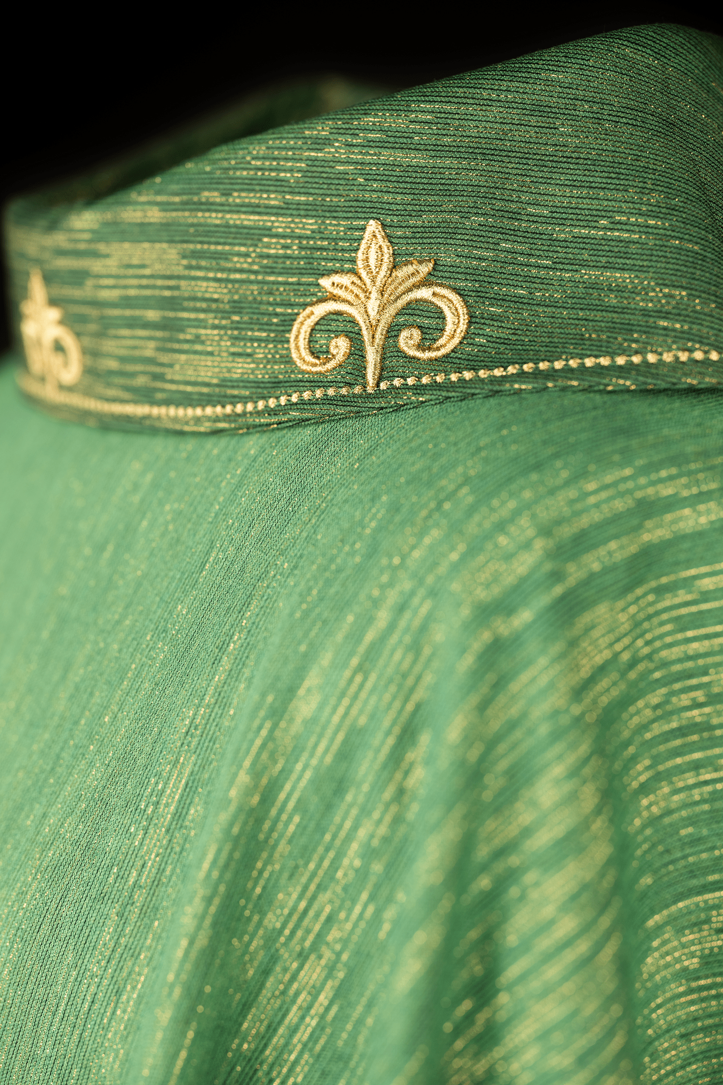 Green chasuble with embroidered cross and decorated collar