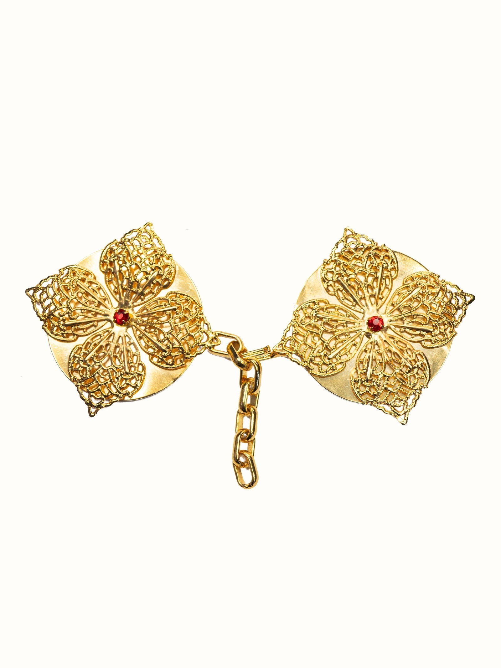 Golden clasp for liturgical vestments with an ornamental stone